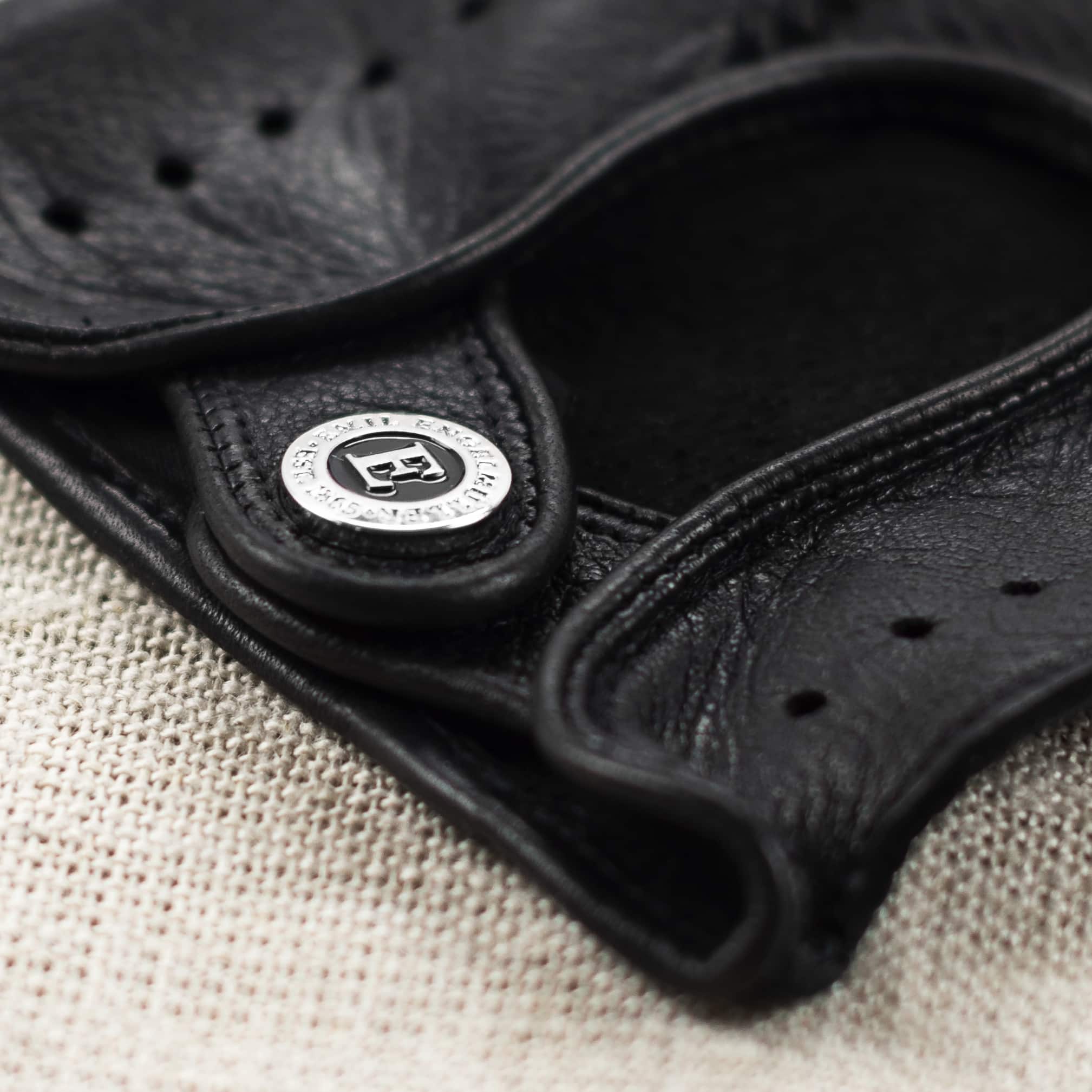 Engelmuller black leather driving gloves crossed